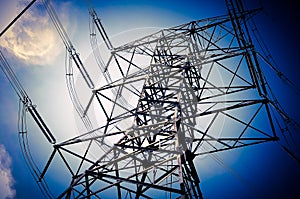 Electricity transmission pylon high voltage pole on blue sky and clouds