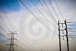 Electricity transmission pylon high voltage pole on blue sky and clouds