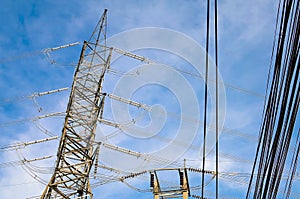 Electricity transmission pylon high voltage pole on blue sky and clouds