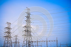 Electricity transmission pylon high voltage pole on blue sky and clouds