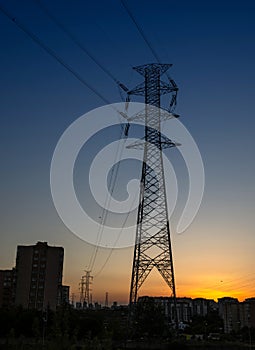 Electricity transmission tower with sunset