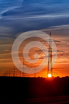 electricity transportation with hgh voltage wire on pylon photo