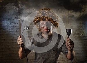 Electrocuted man with cable smoking after domestic accident with dirty burnt face shock electrocuted expression