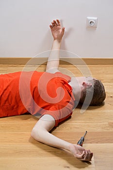 Electrocuted man lying on the floor