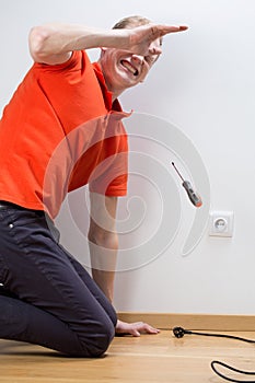 Electrocuted man repairing socket