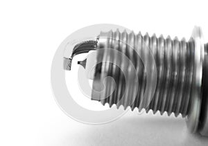 The electrode on the new iridium spark plug. Close up. Isolated on a white background