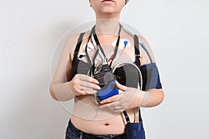 Electrodes Holter monitoring and blood pressure monitor system on the chest of a woman