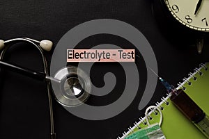 Electrolyte - Test text on top view black table with blood sample and Healthcare/medical concept