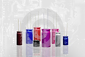 Electrolytic Capacitors, multi color and many sizes background,