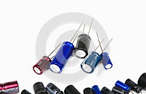 Electrolytic or electrolyte capacitors heap on white background