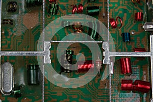 Electromagnetic air-core inductors for high frequencies on circuit board panoramic background