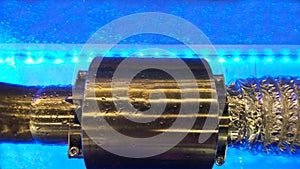 Electromagnetic flowmeter counter under water. Bubbling water. Bubbles and drops fluid, blue backlight. Concert of innovations,