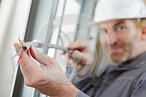 electromechanic holds power cable