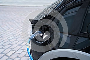 Electromobile charging plug is inserted into vehicle charging socket.