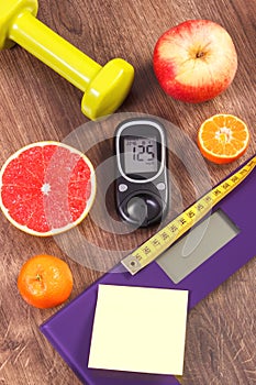 Electronic bathroom scale and glucometer with result of measurement, centimeter, healthy food and dumbbells
