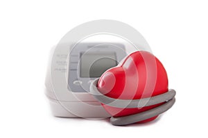 electronic blood pressure meter and red heart