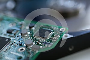 Electronic board with microchips on a hard drive background