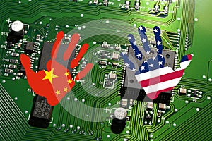 Electronic board with processor and microchip with handprints with the colors of Chinese and USA Flags. Concept for global battle