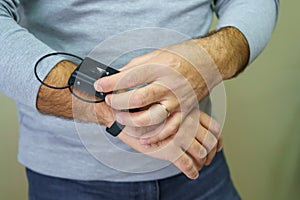 Electronic bracelet for criminals. Gadget for control and monitoring of the execution of punishment