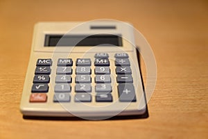 Electronic calculator on a desk