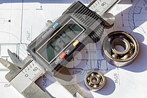 Electronic caliper and used ball bearings closeup