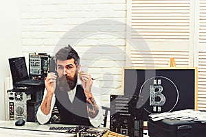 Electronic cash. Bitcoin miner man in server room. Bearded man bitcoiner. Bearded businessman with computer circuits for