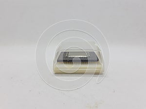 An electronic chip and it`s container in white isolation background