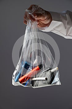 Electronic cigarettes and disposable vapes in a bag.