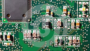 Electronic circuit board close up, with electronic components such as chips. Printed Circuit Board with many electrical components