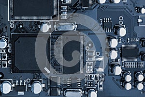 Electronic circuit board close up. toned