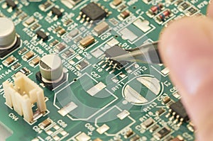 Electronic circuit board, PCB (Printed circuit board) with processor, microchips and glowing digital electronic signals photo