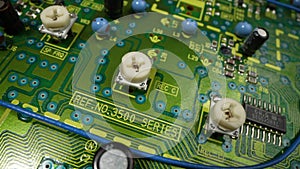 Electronic circuit board with processor, chips and capacitors. Tech science, computer chip, quality control background
