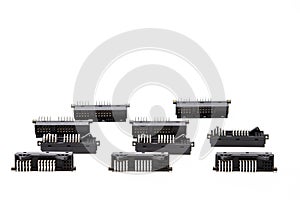 Electronic Components Concepts. Closeup of Rows of Long Angular PCB Connectors or Terminal Blocks Placed in Lines On White