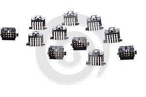 Electronic Components Concepts. Closeup of Rows of Short Angular PCB Connectors or Terminal Blocks Placed in Lines On White
