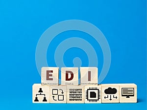 Electronic data interchange concept with icons on wooden cubes.