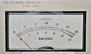 Electronic DC power supply with needle display in volts and amperes.