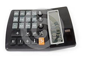 Electronic desk calculator on white background, side view close-up