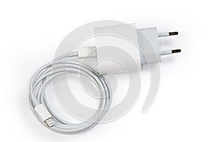 Electronic devices charger with AC Europlug and connected Lightning cable