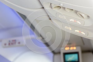 Electronic devices off and fasten seat belt sign inside airplane