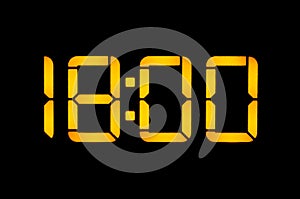 Electronic digital clock with orange numbers on a black background shows the time. Eighteen zero zero in the evening. Isolate,