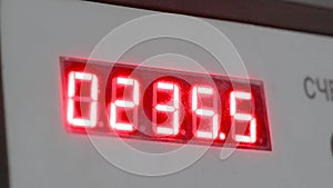 Electronic digital dial meter counter. Red numbers on the counter