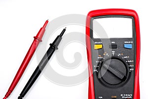 Electronic digital multimeter isolated on white with probes. Digital multimeter with red and black leads. Electronic multimeter is