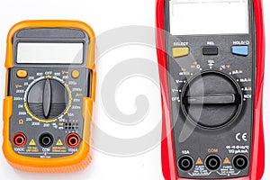 Electronic digital multimeter isolated on white with probes. Digital multimeter with red and black leads. Electronic multimeter is