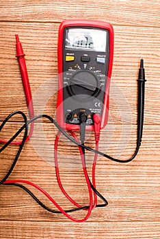 Electronic digital multimeter isolated on white with probes. Digital multimeter with red and black leads. Electronic multimeter is