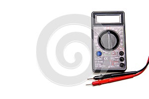 Electronic digital multimeter isolated on white with probes.