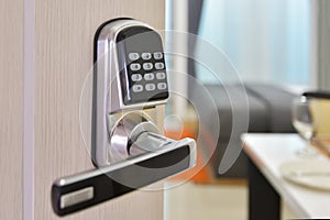 Electronic door access control system machine with number password door..Half opened door handle closeup, entrance to a living