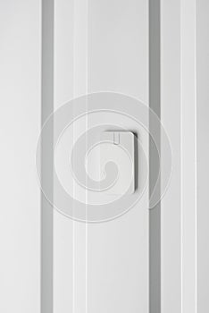 Electronic door lock on white wall