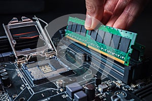 Electronic engineer of computer technology. Maintenance computer hardware upgrade of motherboard putting the Ram on the