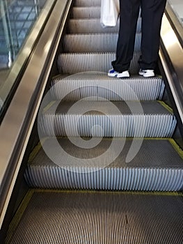 Electronic escalator moving upwards in an airport