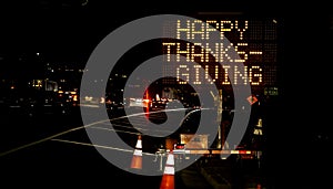 An electronic freeway sign stating Happy Thanksgiving photo